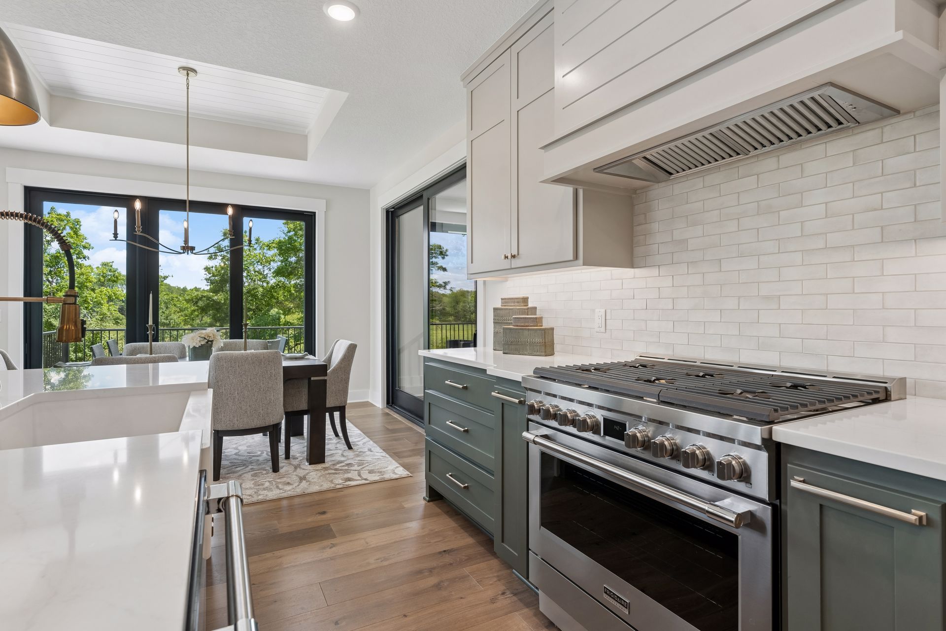 Custom kitchen featuring professional gas range and designer finishes